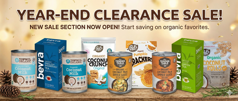 Year-end clearance sale banner with various food products on a wooden surface.